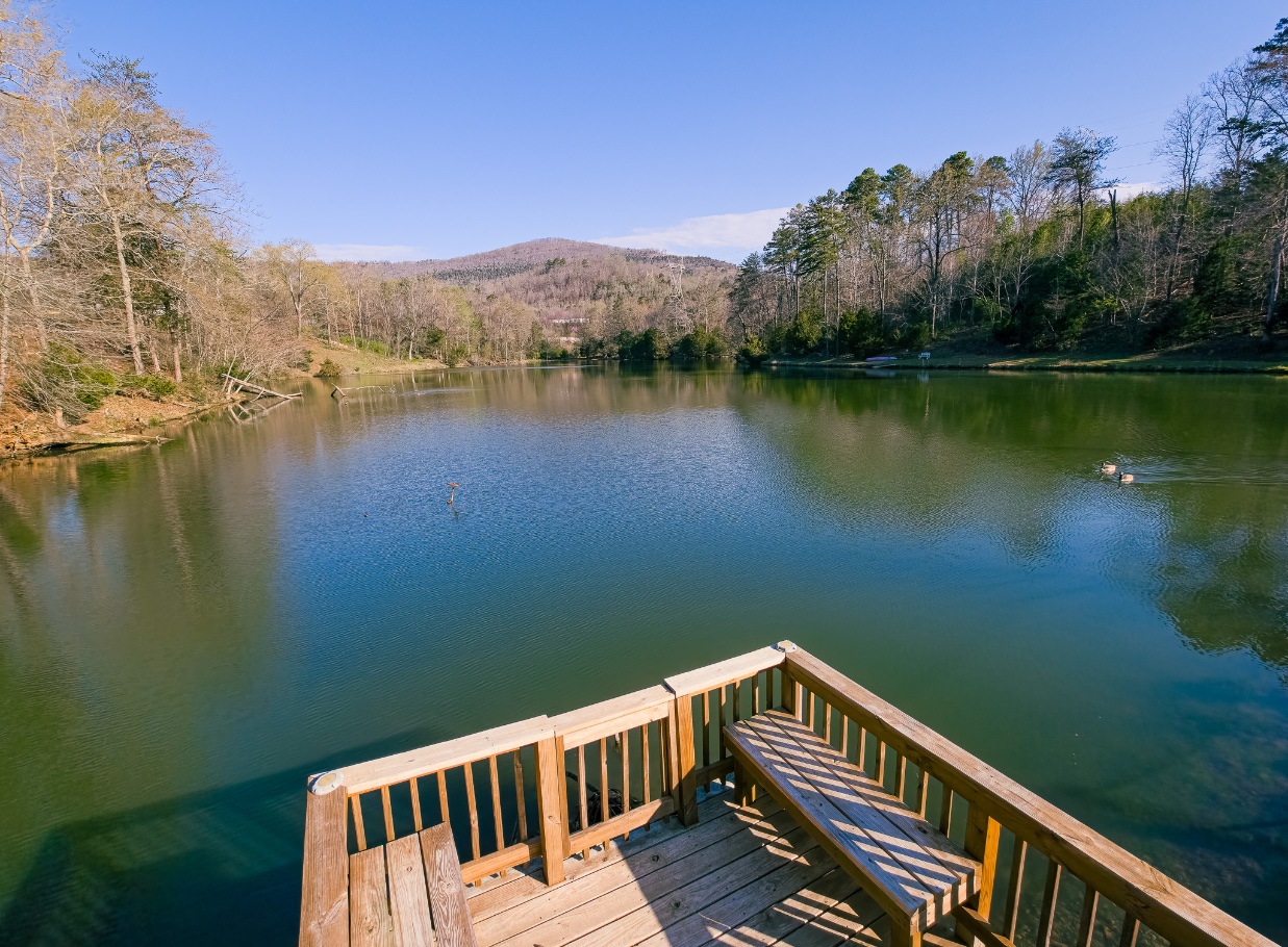 Wildwood’s peaceful lakeside deck overlooking the water and surrounding mountain ridge