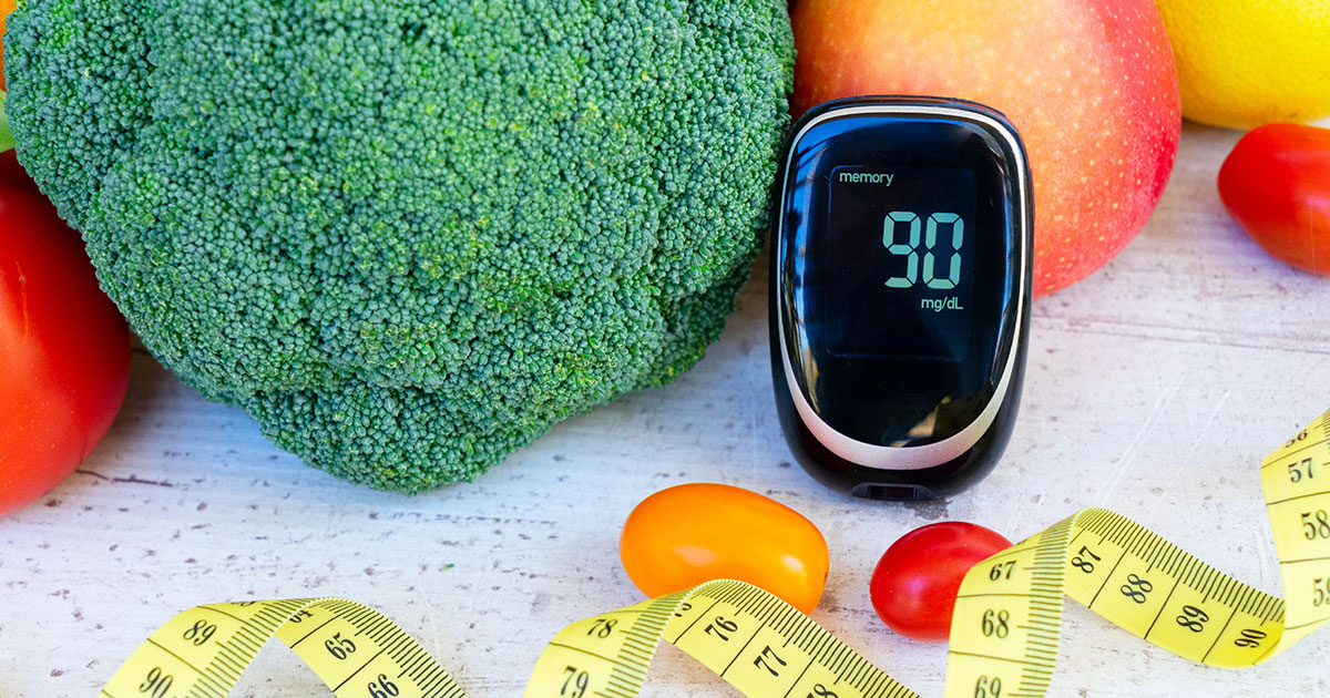 raw vegetables with blood glucose meter